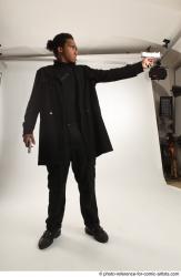 Man Adult Average Black Fighting with gun Standing poses Coat